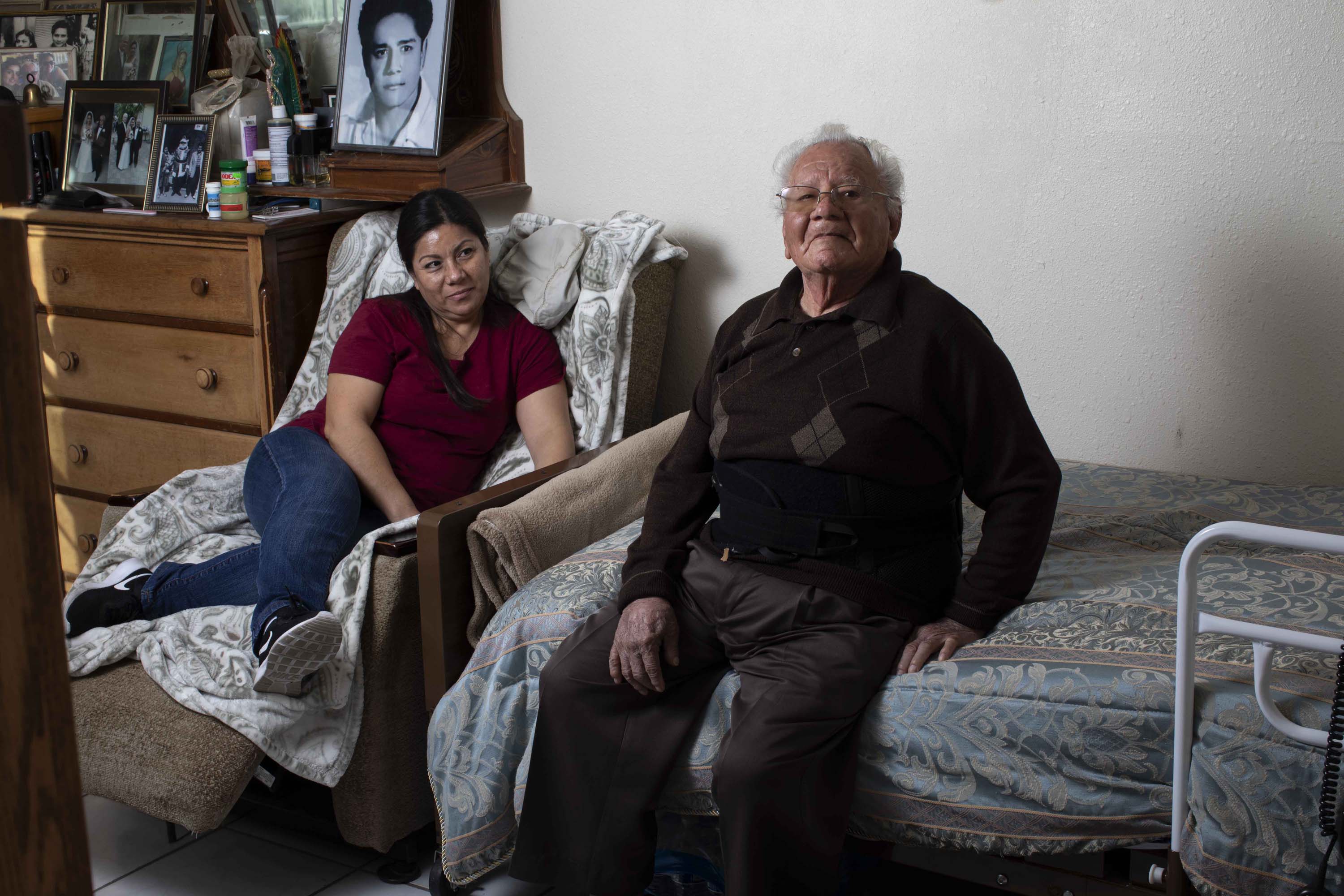 Cristina Hernandez sits near her dad, Francisco Rios, 91, in her Pomona home. Hernandez has been his primary caregiver for 15 years.